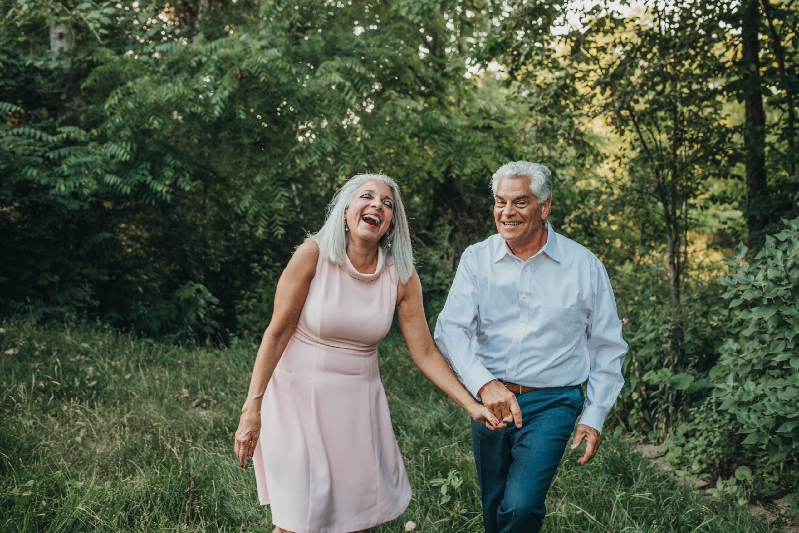 Man and woman walking and holding hands.